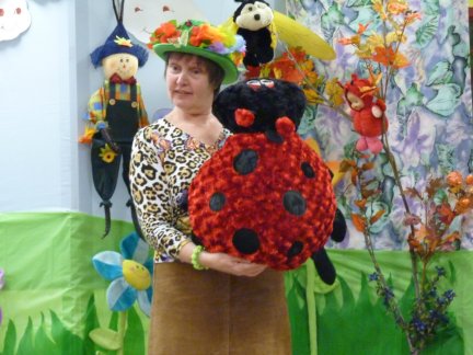 Suzanne D'Aoust with ladybug - book reading session